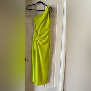 Marciano lime colored one shoulder gown with slit in the from leg
